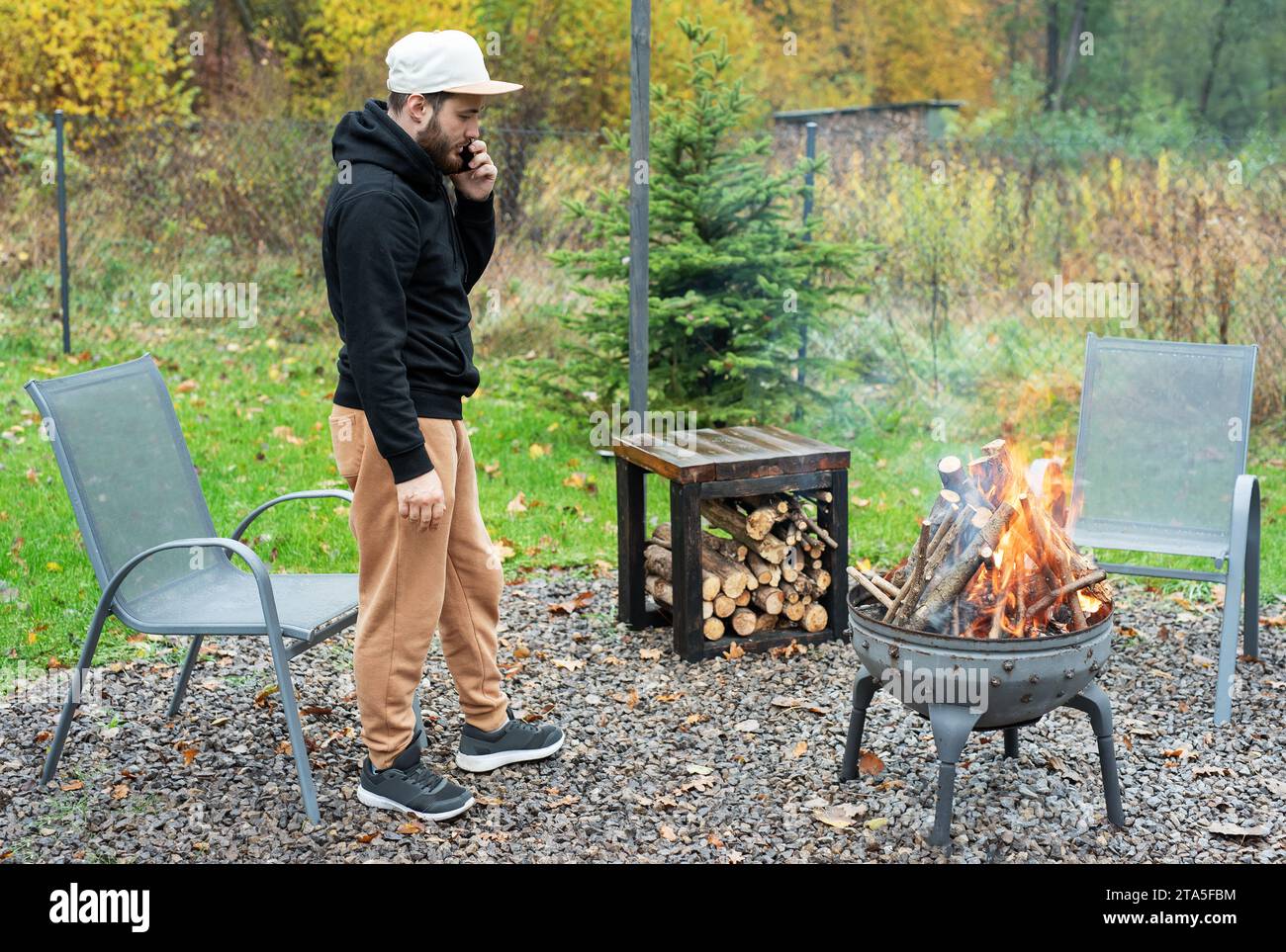 Man starting fire in backyard hi-res stock photography and images - Alamy