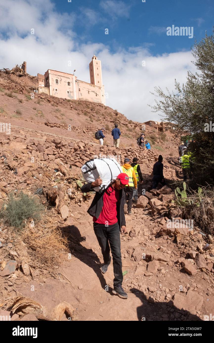 Local volunteers transport ShelterBox aid at Tinmel following 8th September's earthquake that struck the Atlas Mountains in Morocco Stock Photo