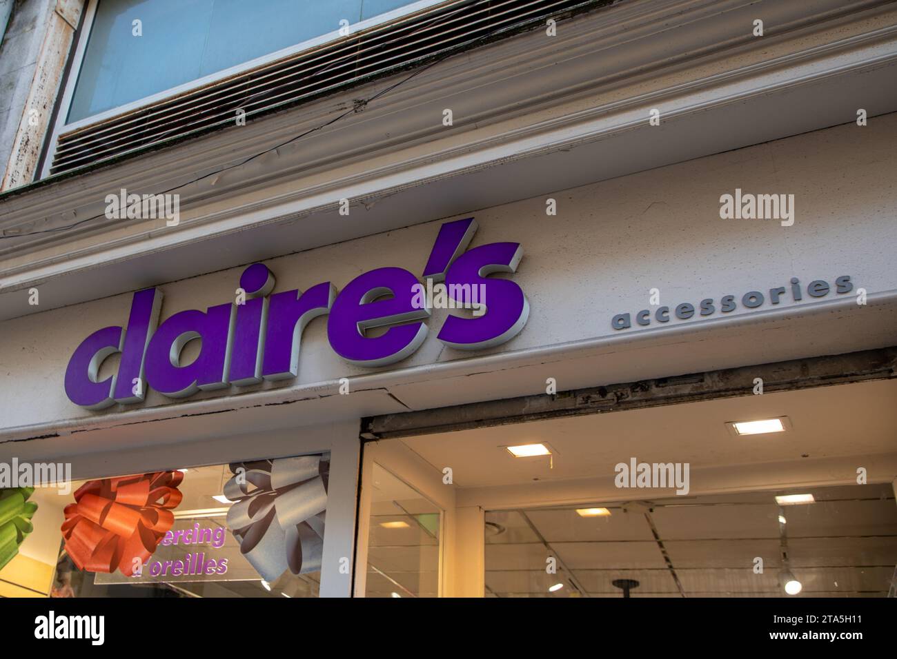 claires accessories store sign and brand text logo boutique Claire's on wall facade shop retailer accessories and jewelry chain Stock Photo