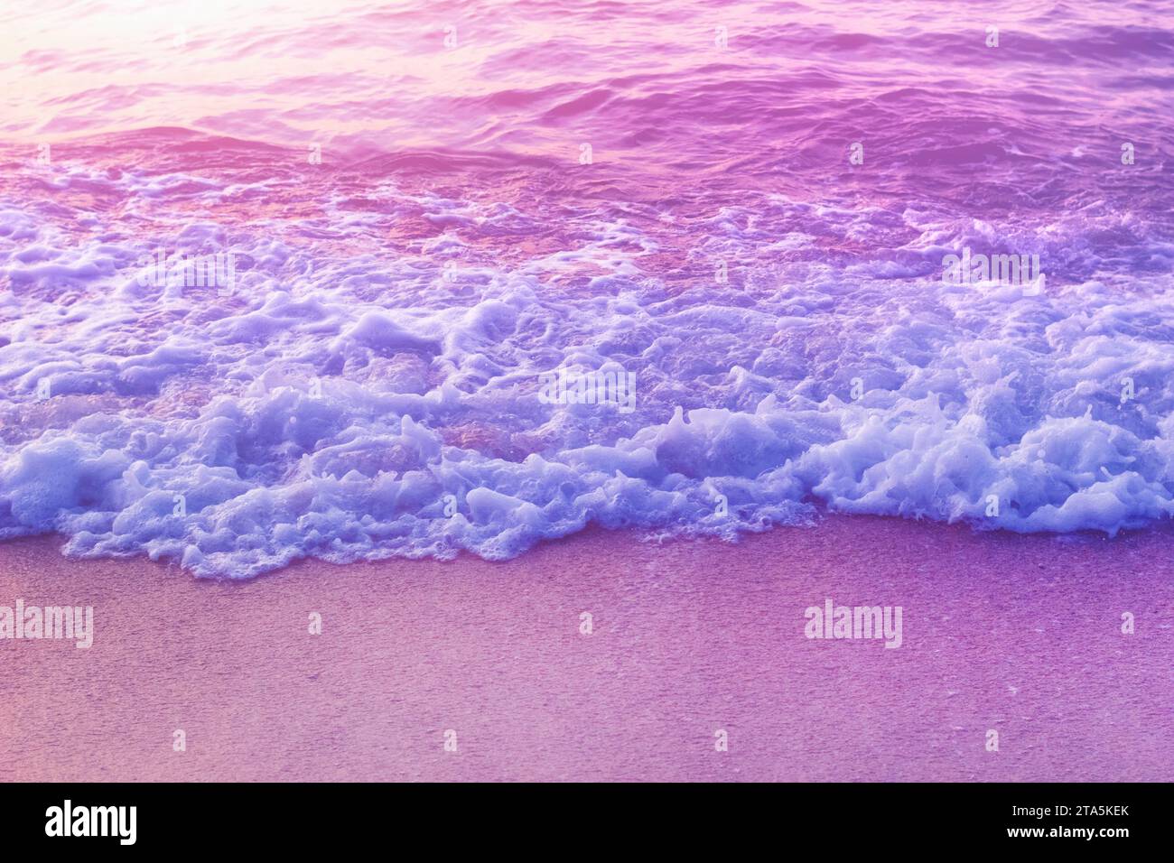 Tender Dreamy Pink Sea Waves On Shore. Filtered Color. Stock Photo