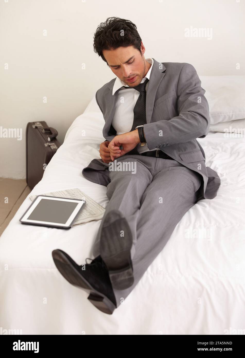 Man Checking Businessmen checking the time hi-res stock photography and images - Alamy