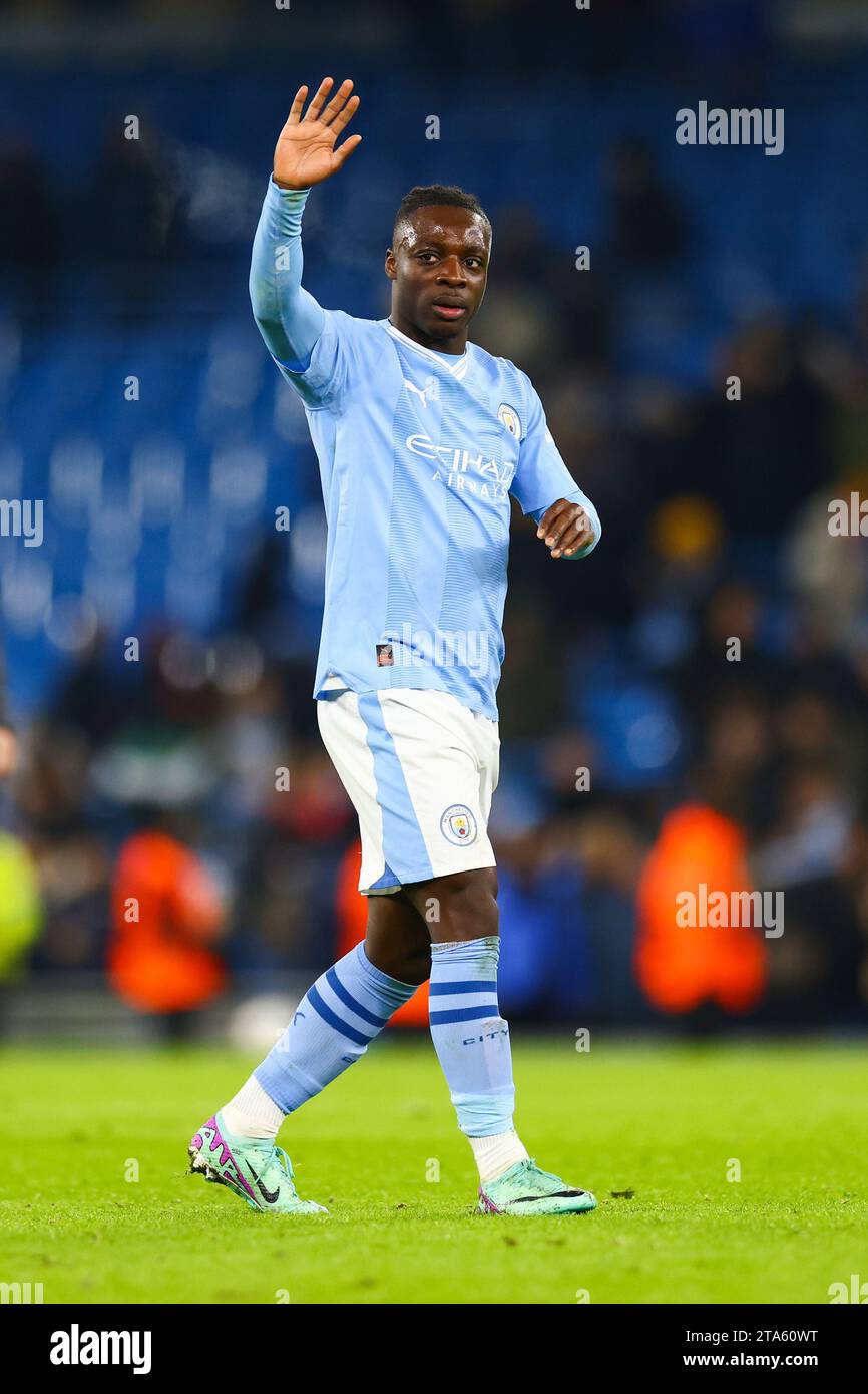 Manchester, UK. 29th Nov, 2023. Jeremy Doku of Manchester City during a challenge during the Manchester City FC v RB Leipzig FC UEFA Champions League Round 1 Group G match at Etihad Stadium, Manchester, England, United Kingdom on 28 November 2023 Credit: Every Second Media/Alamy Live News Stock Photo