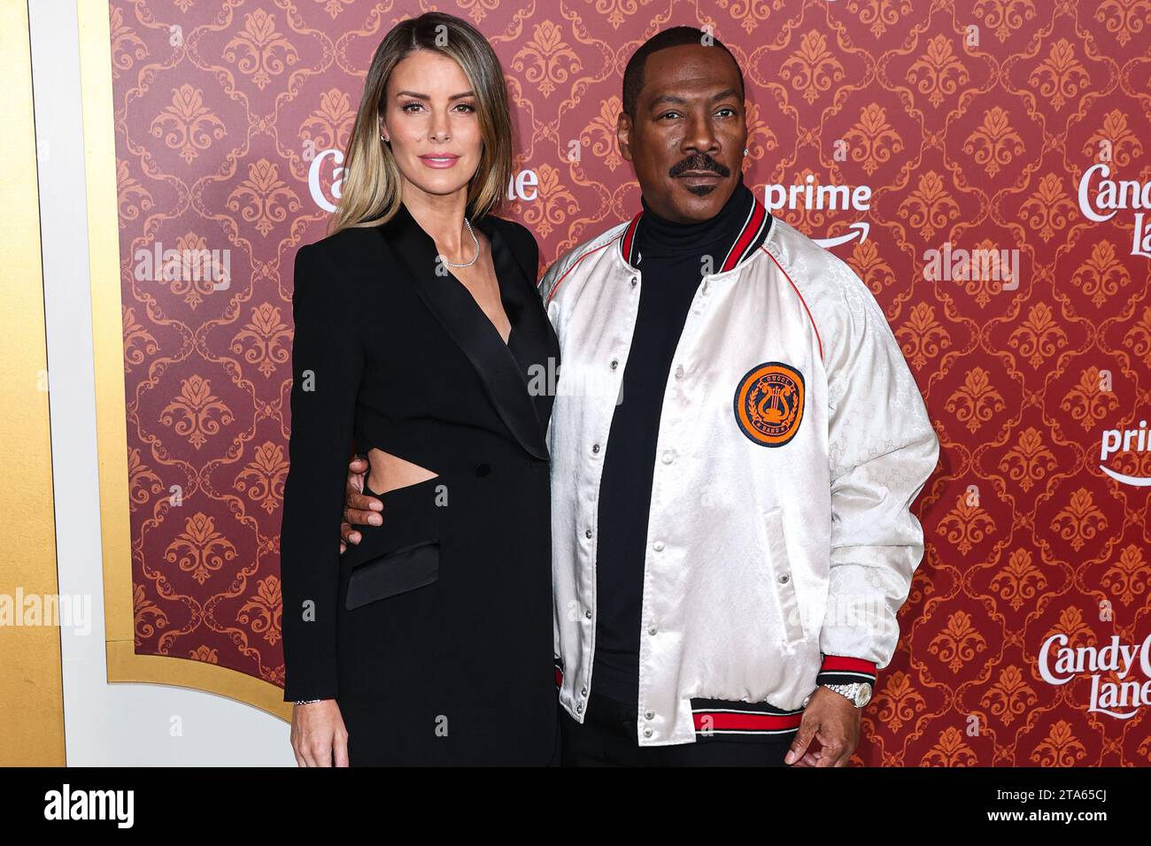 Westwood, United States. 28th Nov, 2023. WESTWOOD, LOS ANGELES, CALIFORNIA, USA - NOVEMBER 28: Australian actress Paige Butcher and fiancé/American actor and comedian Eddie Murphy arrive at the World Premiere Of Amazon Prime Video's 'Candy Cane Lane' held at the Regency Village Theatre on November 28, 2023 in Westwood, Los Angeles, California, United States. (Photo by Xavier Collin/Image Press Agency) Credit: Image Press Agency/Alamy Live News Stock Photo