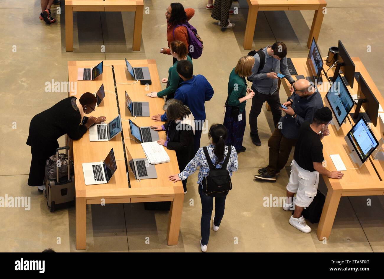 New York, USA - June 08, 2018: People in store Apple Fifth Avenue in New York, NY. Stock Photo
