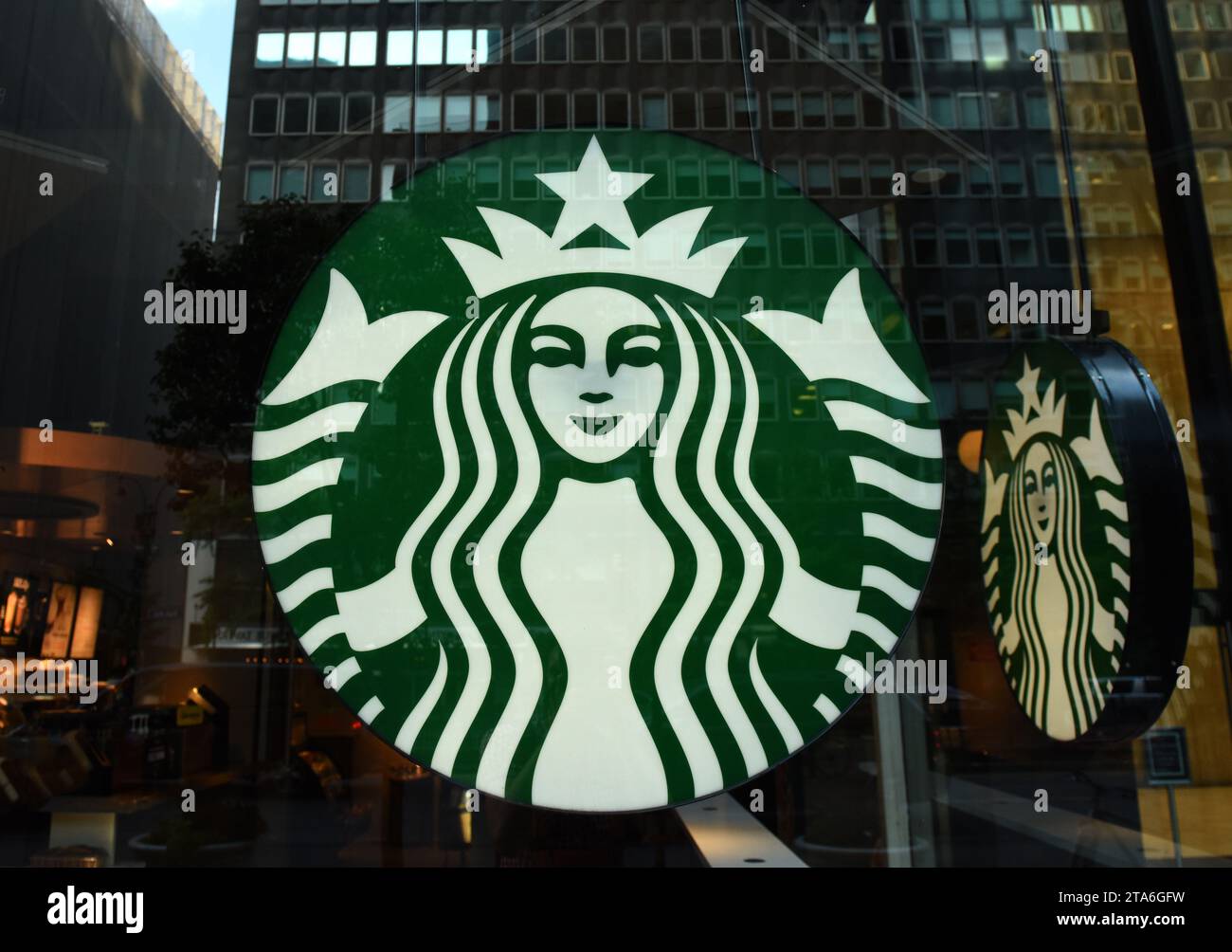 New York, USA - May 26, 2018: Starbucks Coffee logo at Starbucks cafe in Midtown of Manhattan. Stock Photo