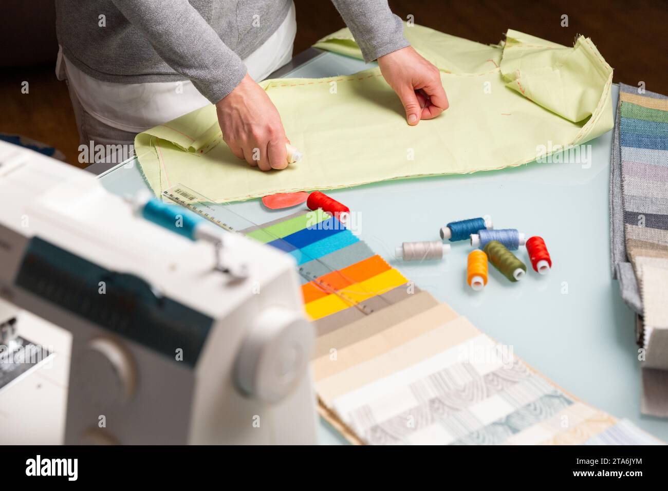 Women hands during sewing process hi-res stock photography and images ...