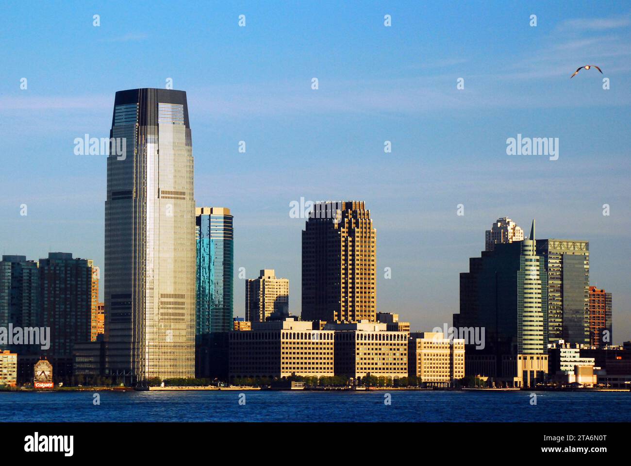 The skyline of Jersey City New Jersey contains office buildings and apartments along the Hudson
