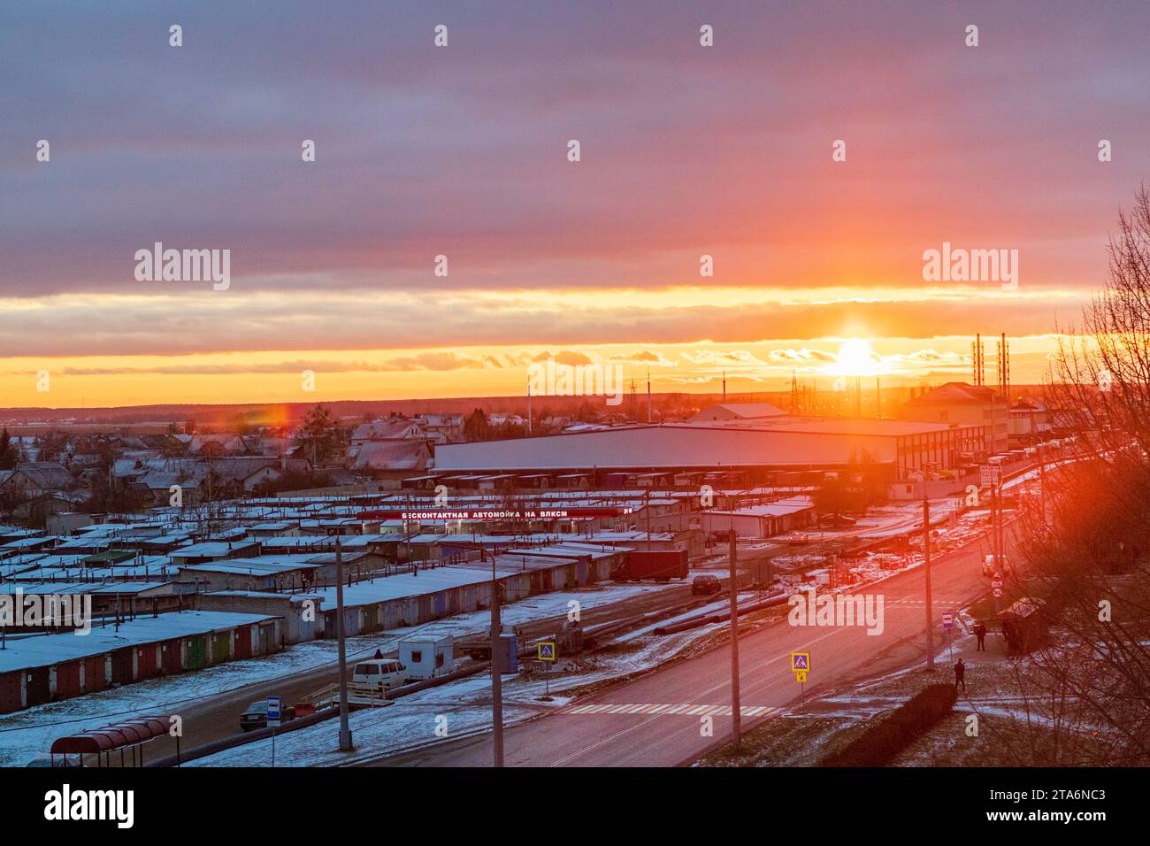 Brest, Belarus -11.25.2023 - Shot of the dramatic sunset in the rural city in the cold evening Stock Photo