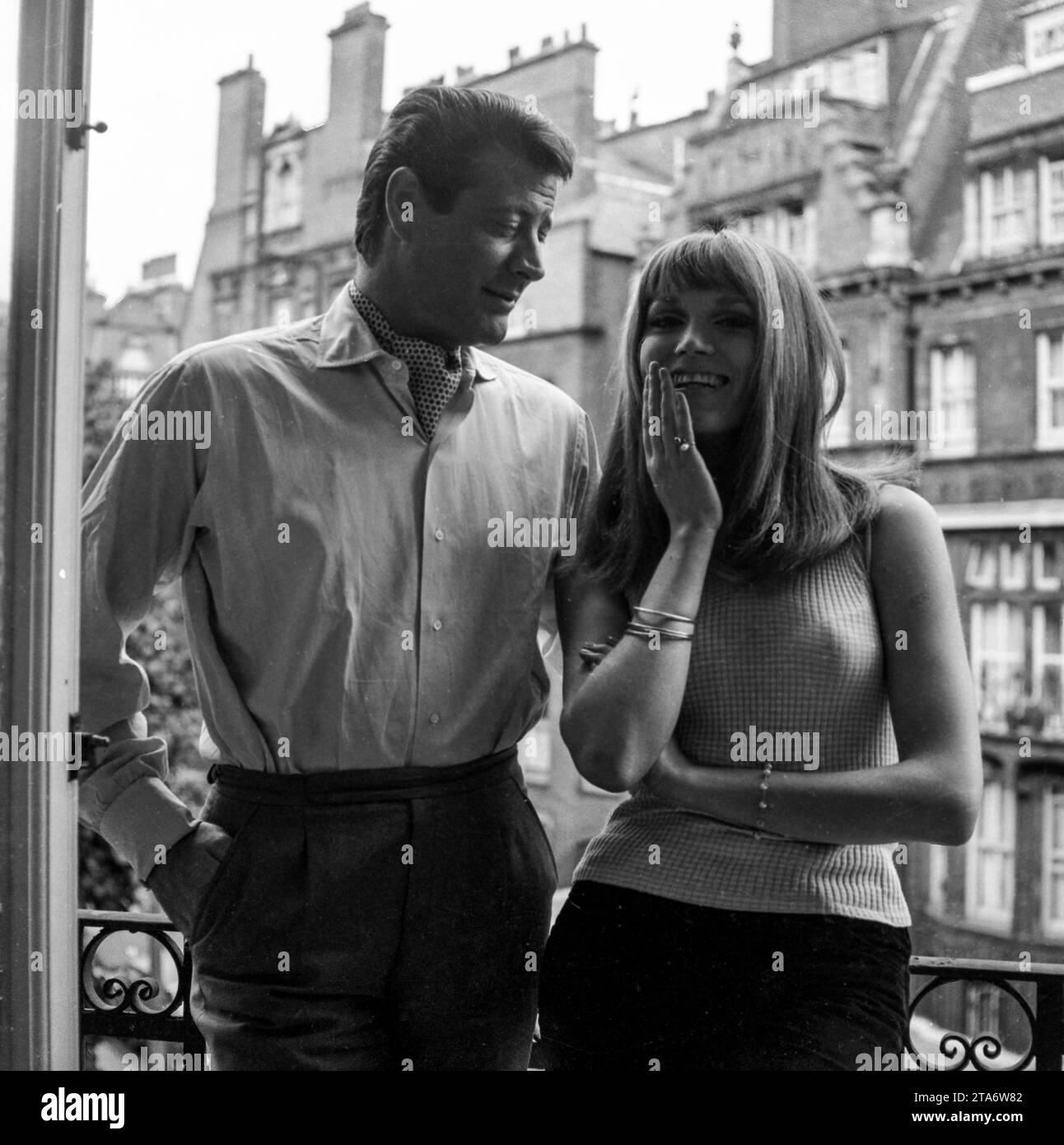 Peki D'Oslo (later Amanda Lear) with Baron Pierre Cervello on the balcony of his Chelsea flat in the 1960s Stock Photo