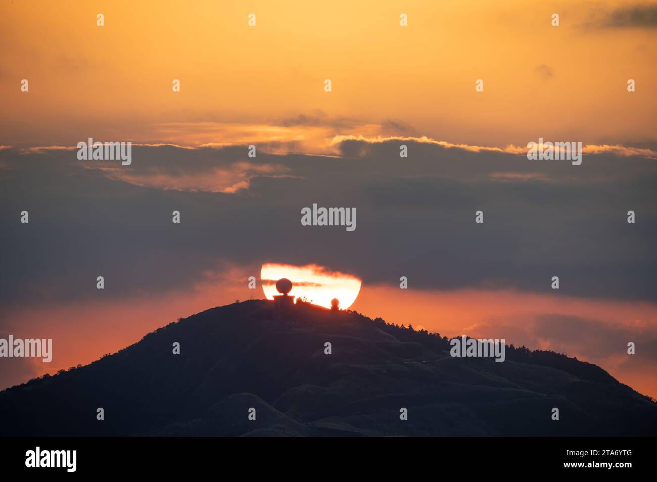 Sun Set Process Spectacular close-up of the sunset process. Orange flaming sky. In the ...