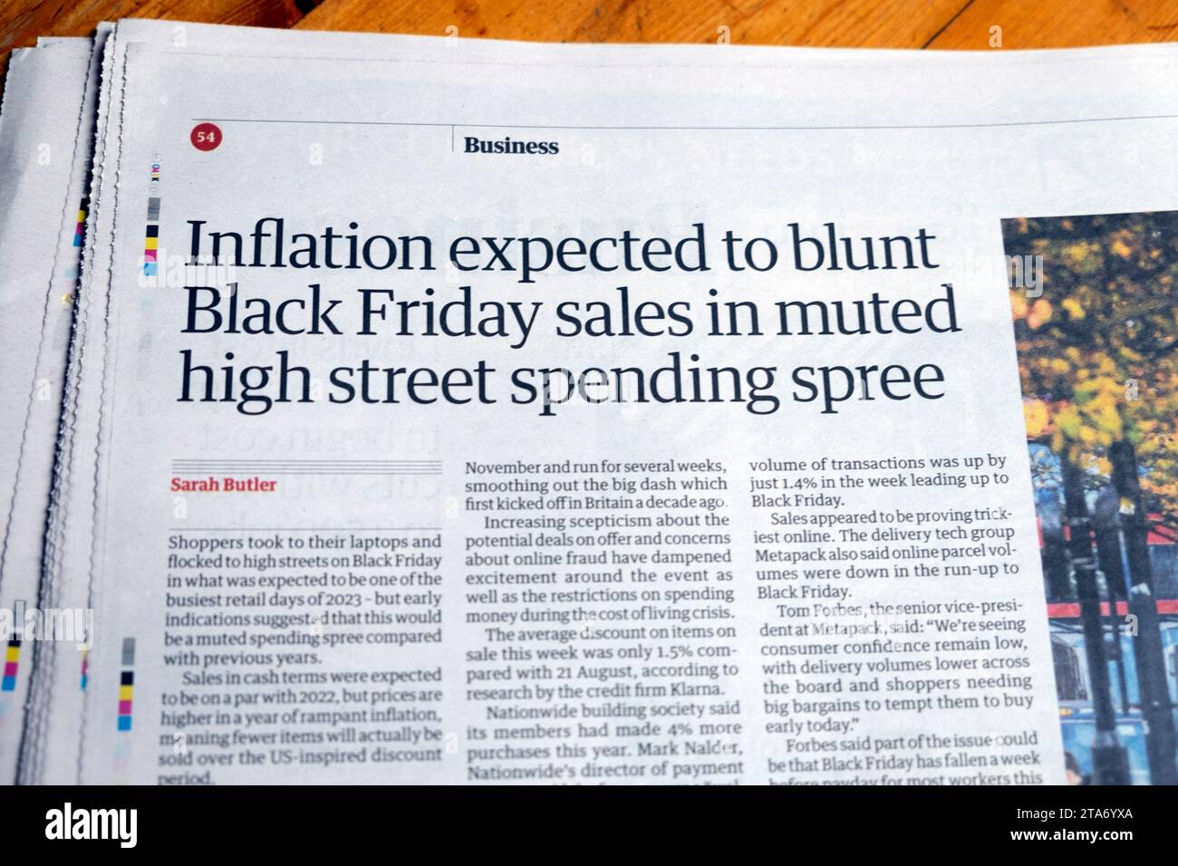 'Inflation expected to blunt Black Friday sales in muted high street spending spree' Guardian newspaper headline retail article November 2023 UK Stock Photo