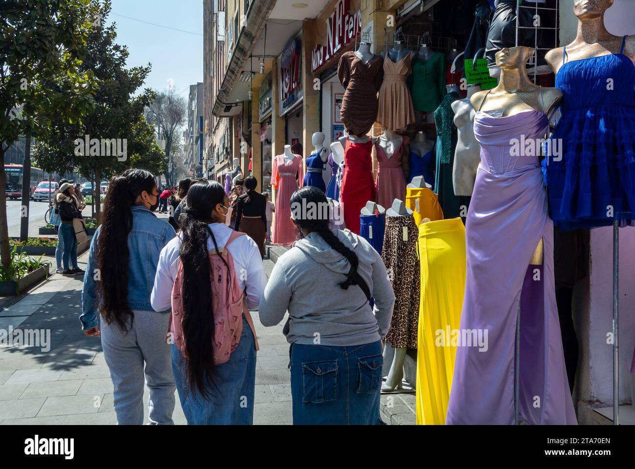 Mexico City, CDMX, Mexico, Mexican females walking in the street with clothing stores, Editorial only. Stock Photo