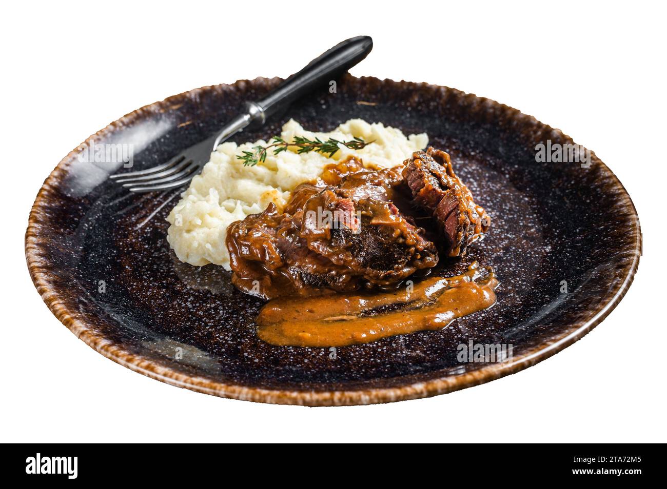 Beef cheeks stewed in red wine sauce with mashed potatoes. Isolated