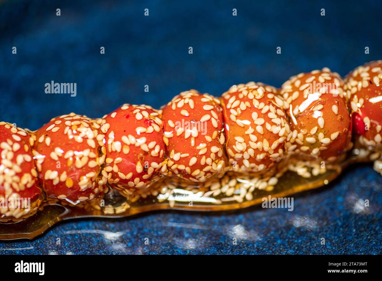Sugar-coated haws on a stick,Chinese traditional food,Street Food Stock Photo