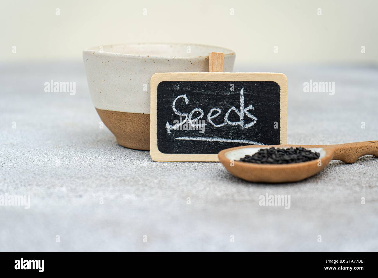 Close-up of organic black and white sesame seeds with a seeds sign Stock Photo