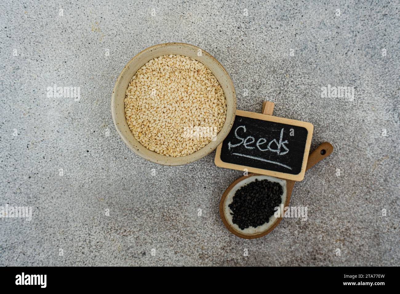 Overhead view of organic black and white sesame seeds with a seeds sign Stock Photo