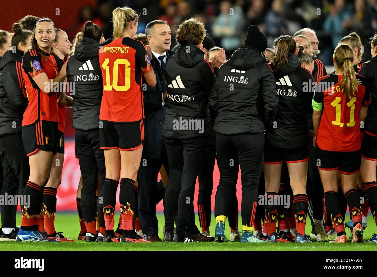 players of Belgium and head coach Ives Serneels of Belgium celebrate after winning a football match between the national women team of Belgium, called the Red Flames and England , called the Lionesses on matchday 4 in the 2023-24 UEFA Women's Nations League competition in group A1 , on Tuesday 31 October 2023 in Leuven, Belgium. Photo Stijn Audooren | Sportpix Stock Photo