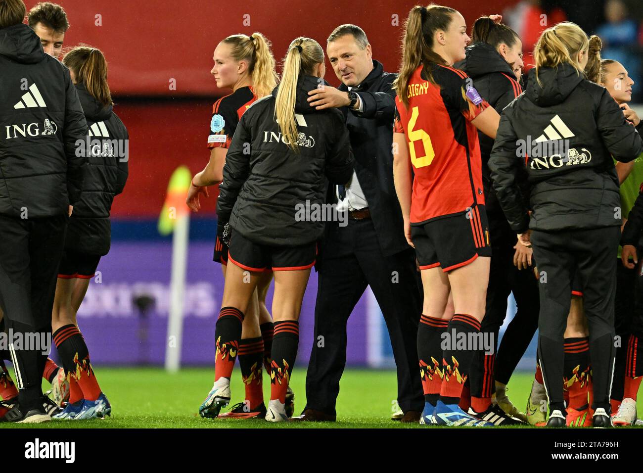 players of Belgium and head coach Ives Serneels of Belgium celebrate after winning a football match between the national women team of Belgium, called the Red Flames and England , called the Lionesses on matchday 4 in the 2023-24 UEFA Women's Nations League competition in group A1 , on Tuesday 31 October 2023 in Leuven, Belgium. Photo Stijn Audooren | Sportpix Stock Photo
