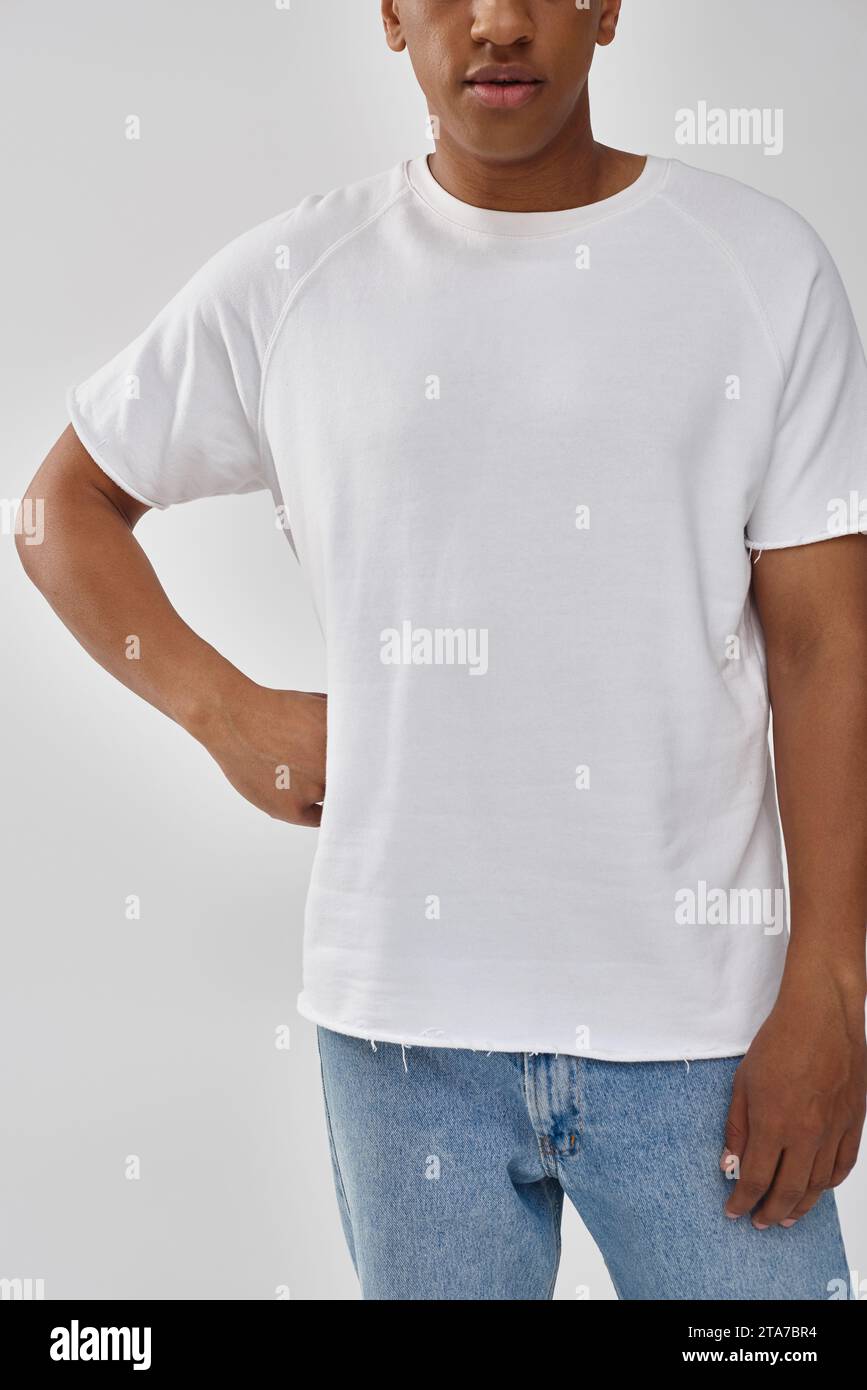 stylish african american man in trendy casual jeans and white t-shirt, copy space for advertising Stock Photo