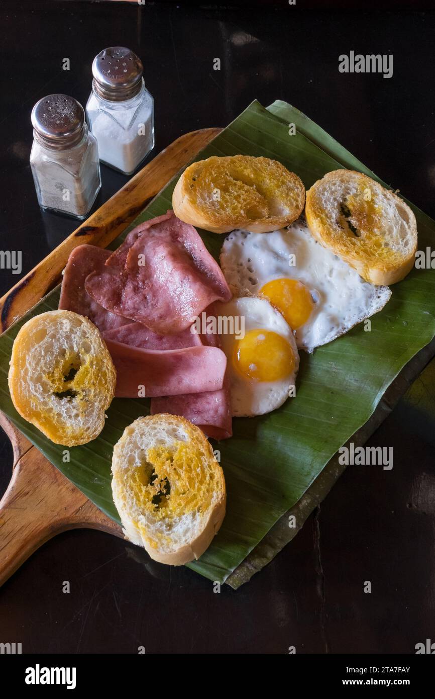 Breakfast with fried eggs and ham in a restaurant in Costa Rica Stock