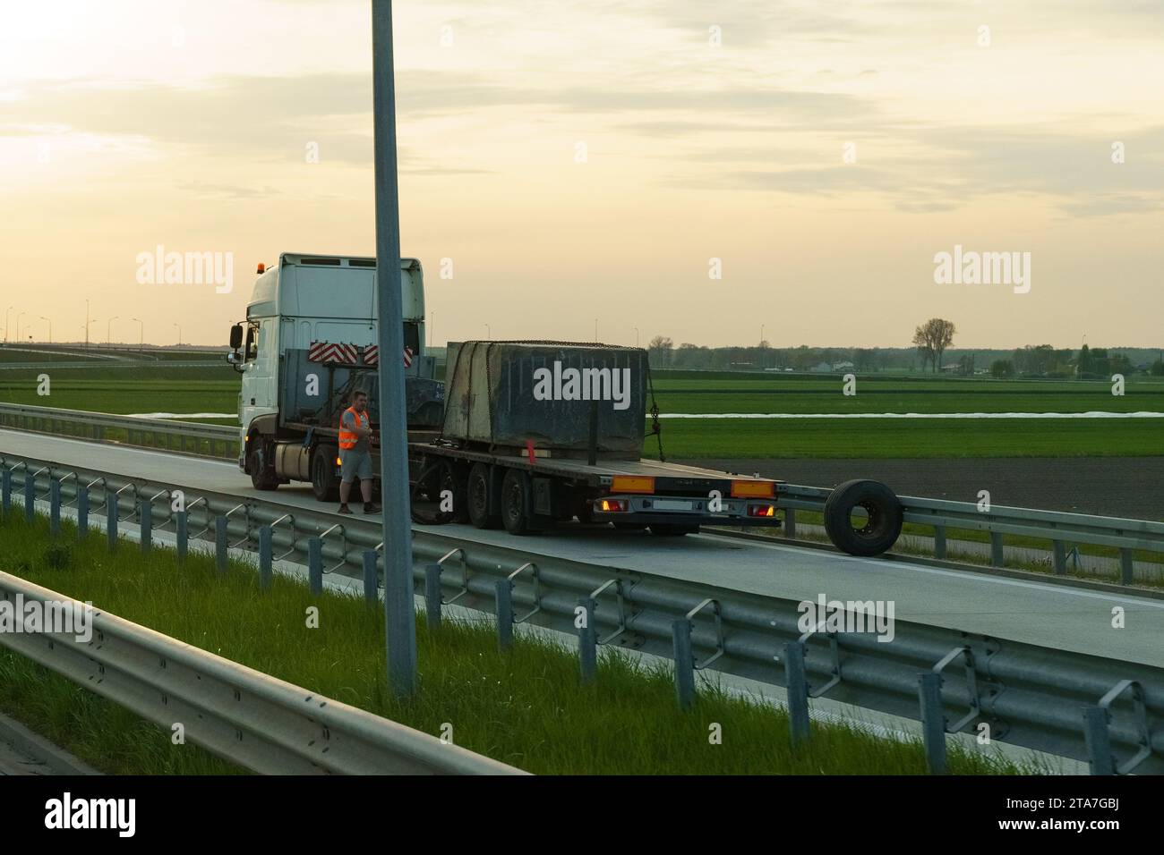 Lubon, Poland - May 5, 2023: Truck breakdown on the highway, changing a wheel on a semi-trailer. Stock Photo