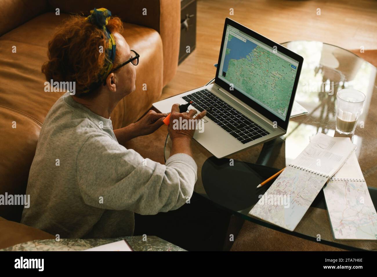 Planning a trip laptop map hi-res stock photography and images - Alamy