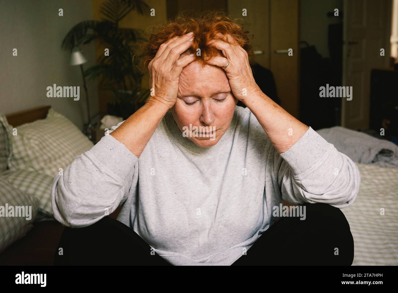 Woman head in hands anxiety hi-res stock photography and images - Alamy