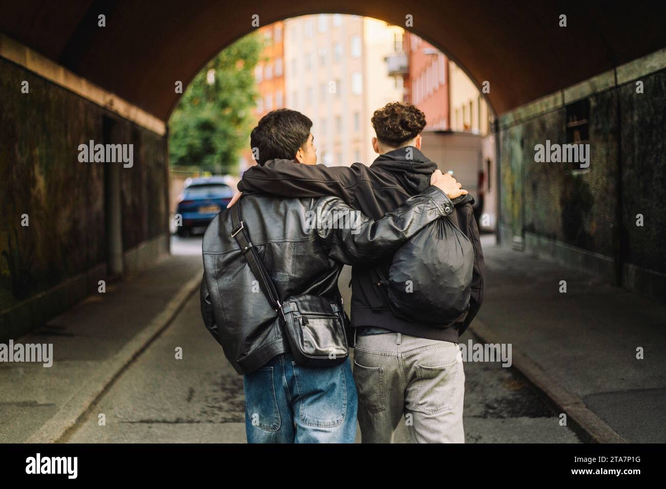 Two friends walk arms around hi-res stock photography and images - Alamy