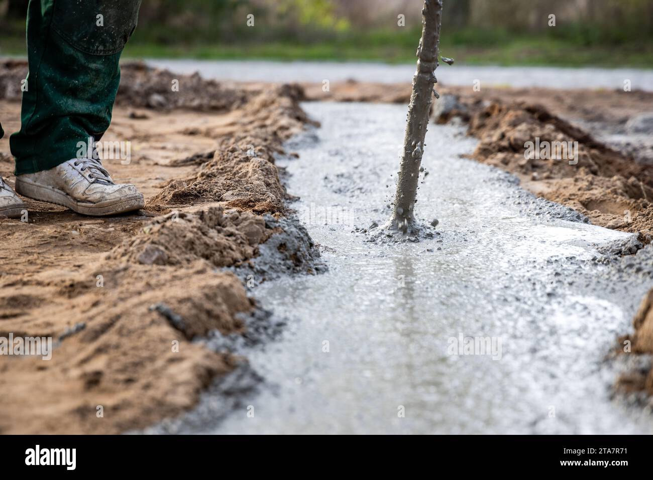 Concrete vibrator head compacting the foundation at a building site