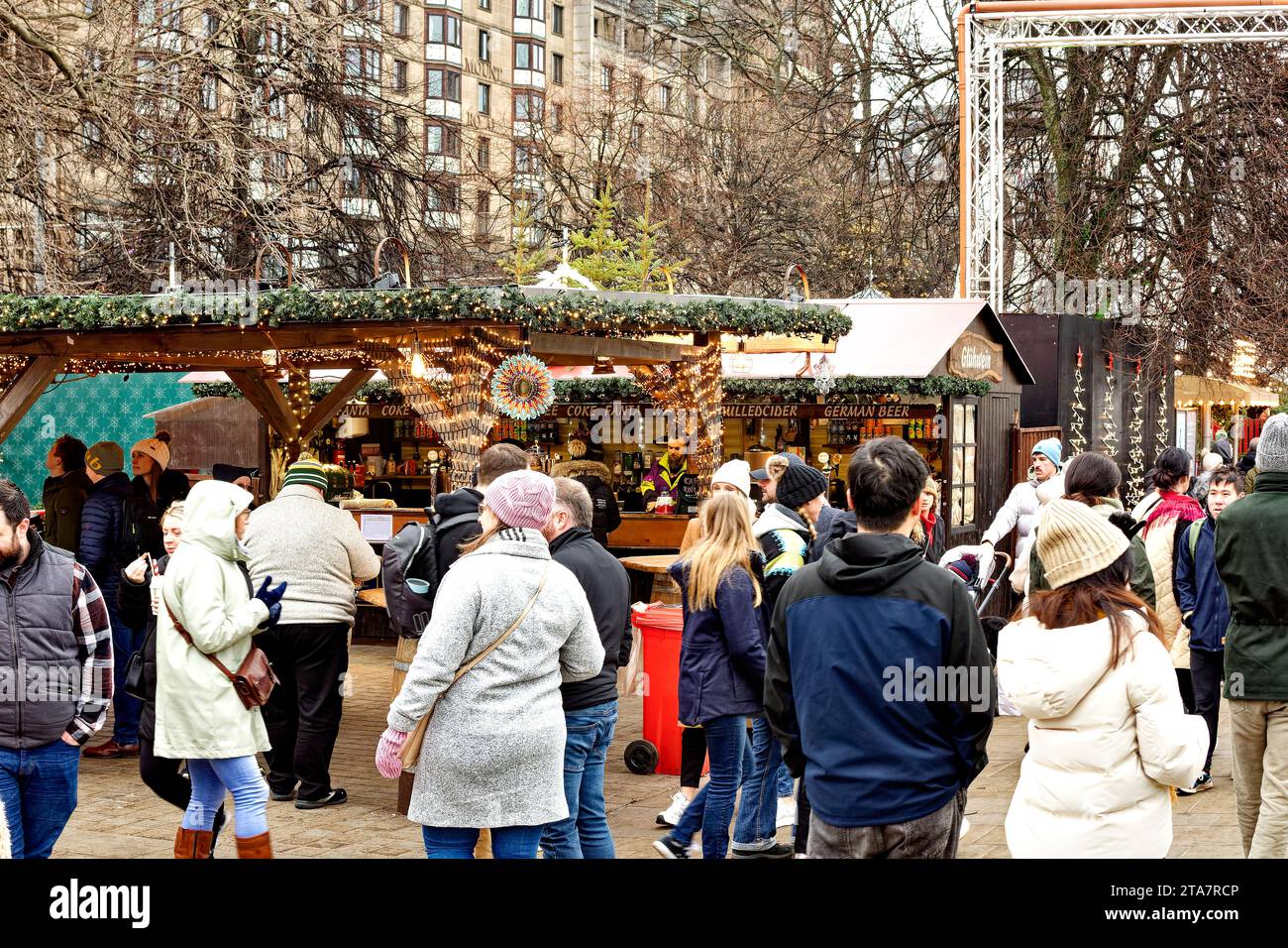 Edinburgh Scotland Christmas Fair or Market Princes Street decorated stalls and visitors Stock Photo