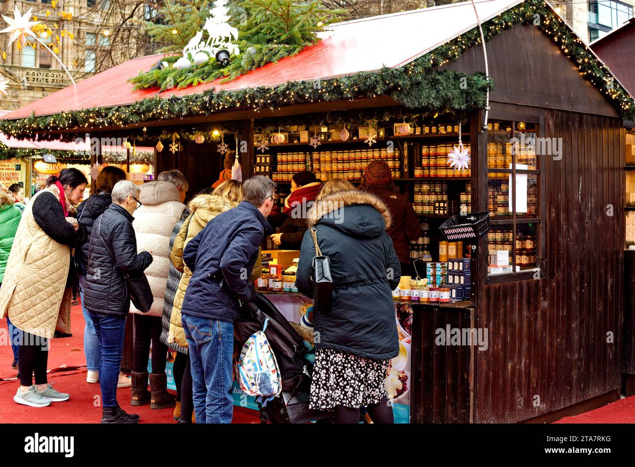 Edinburgh Scotland Christmas Fair or Market Princes Street people at the grocery stall Stock Photo