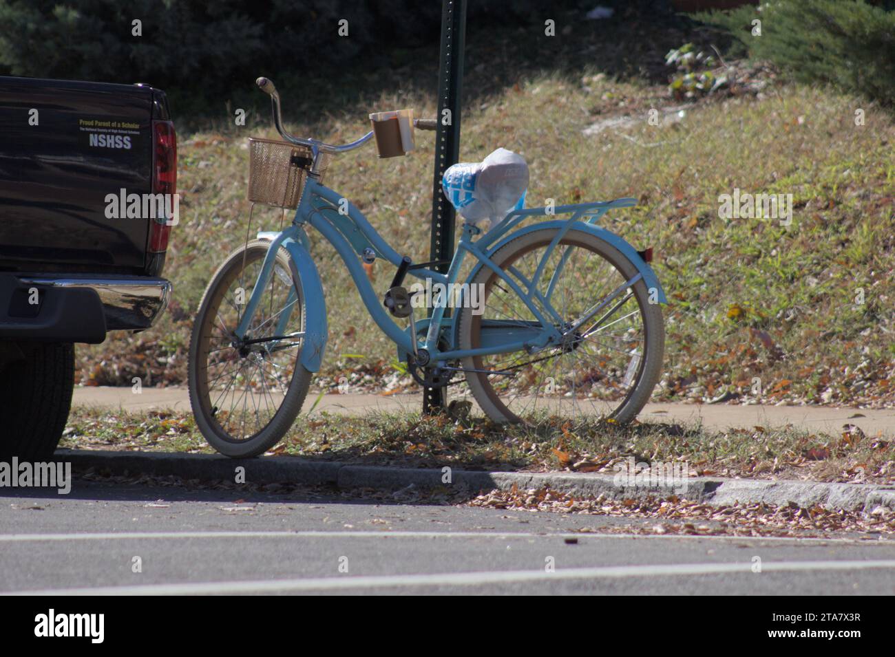 A soft baby blue bike in center. Stock Photo