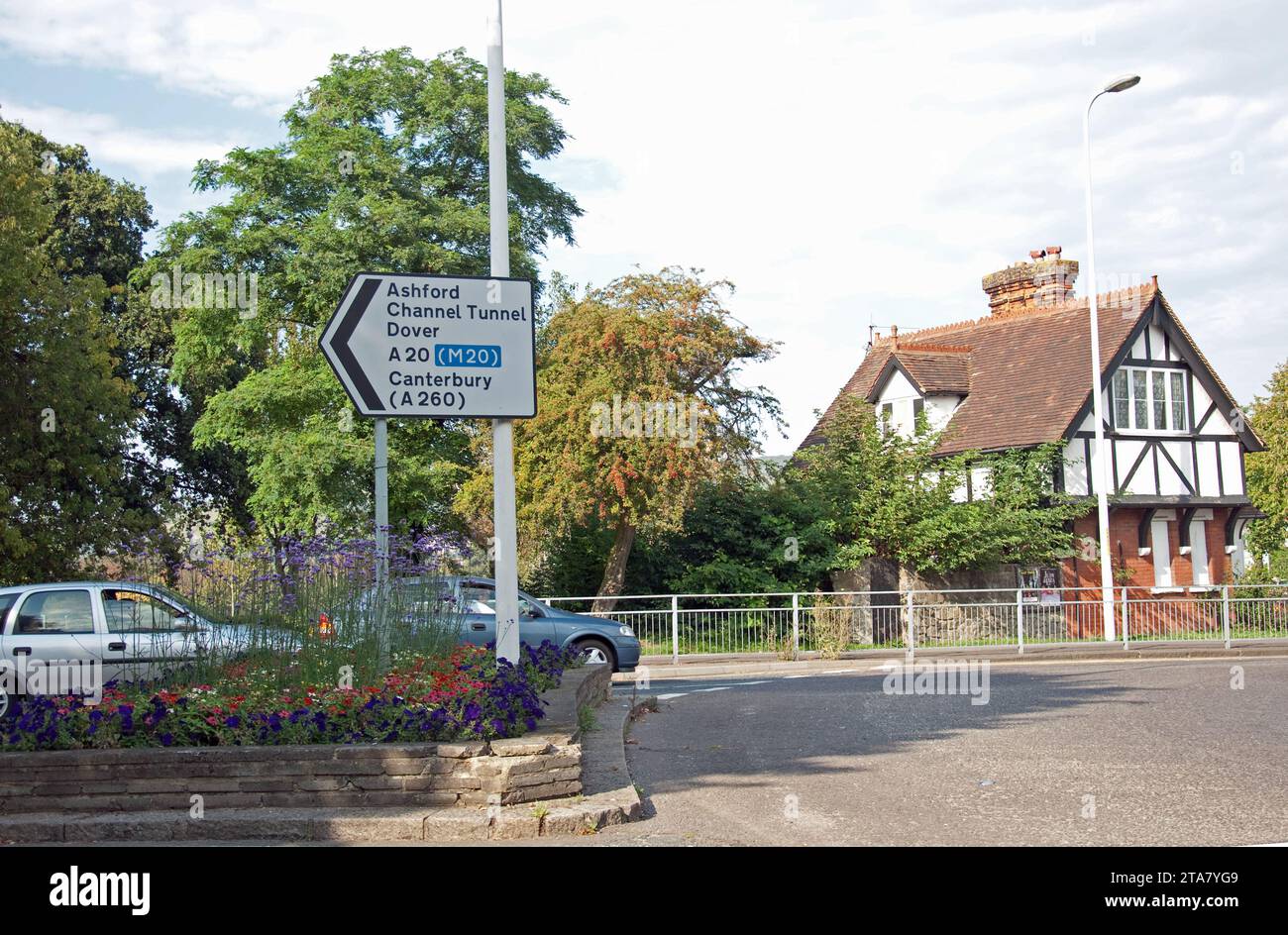 Crossroad with Tudor Style house and road sign, Folkestone, Kent, UK Stock Photo