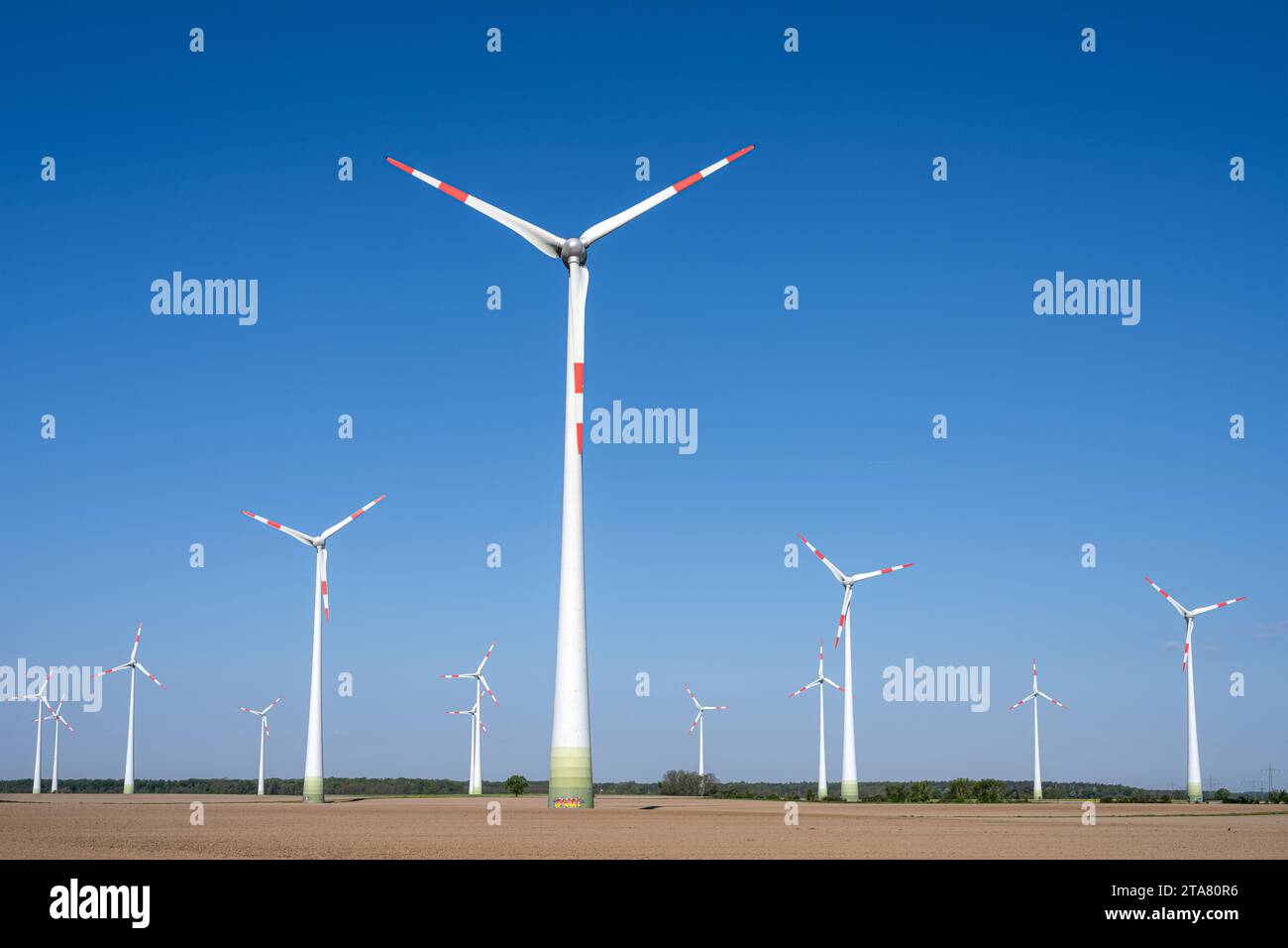 Wind energy turbines in barren fields seen in Germany Stock Photo - Alamy