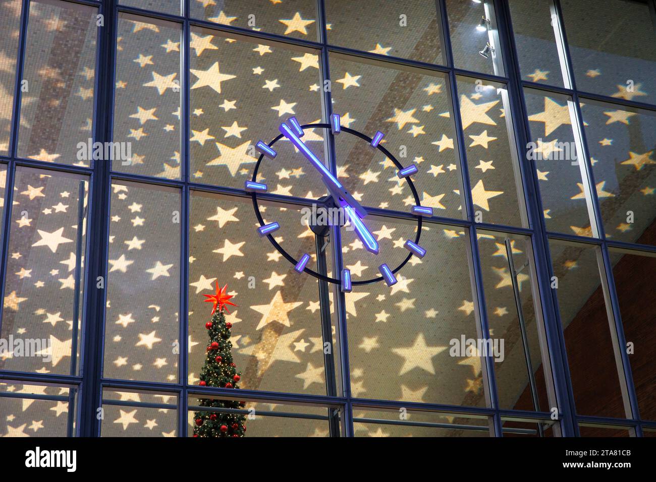 clock of the central station during Christmas time, Christmas illuminated ceiling, Cologne, Germany. Uhr am Hauptbahnhof waehrend der Weihnachtszeit, Stock Photo