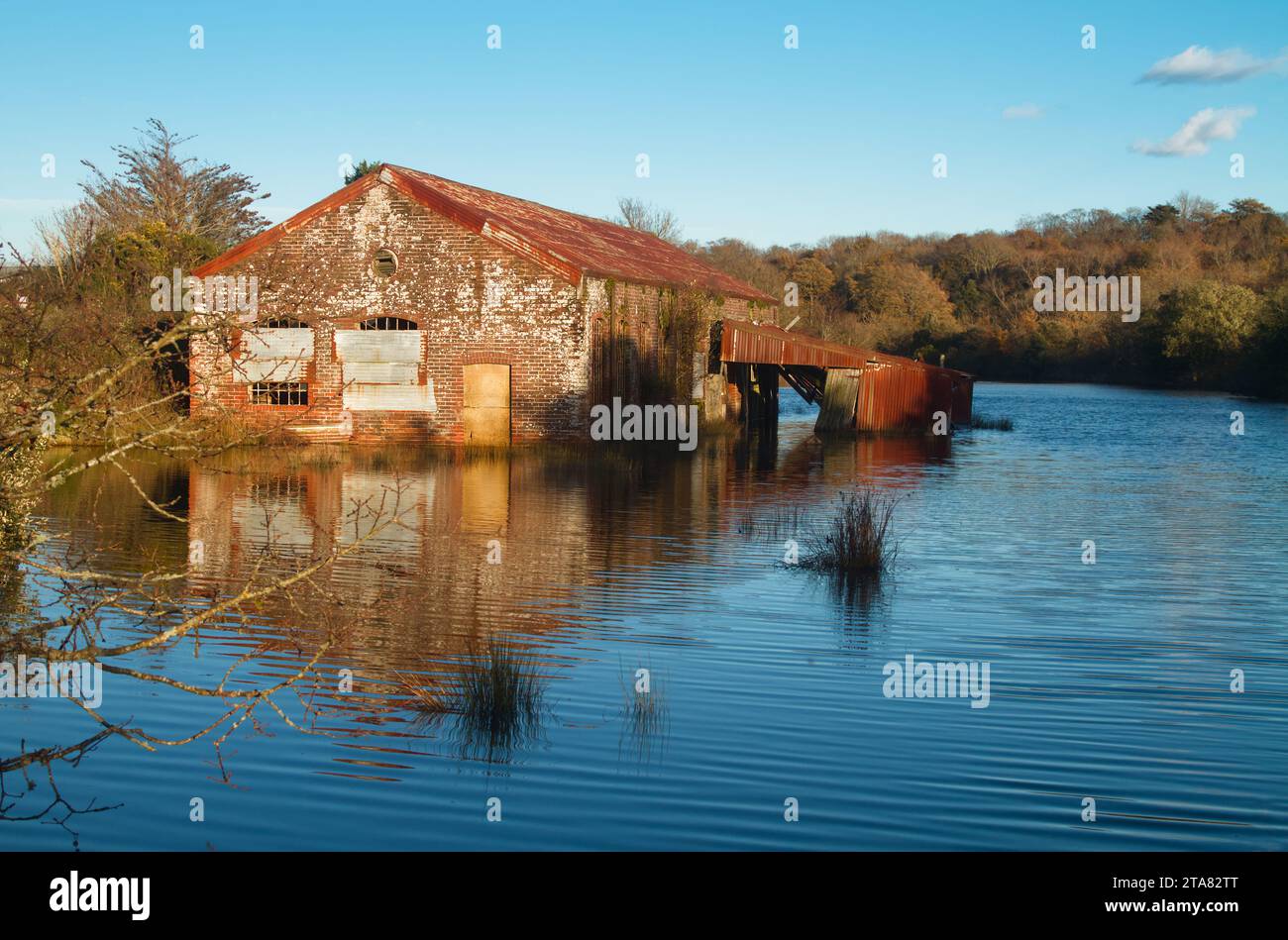 Stone And Brick Abandoned Derelict Boathouse With Corrugated Roof