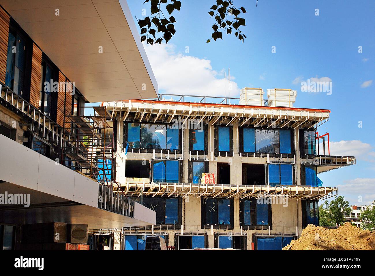 Residential building under construction. Building under construction against blue sky Stock Photo