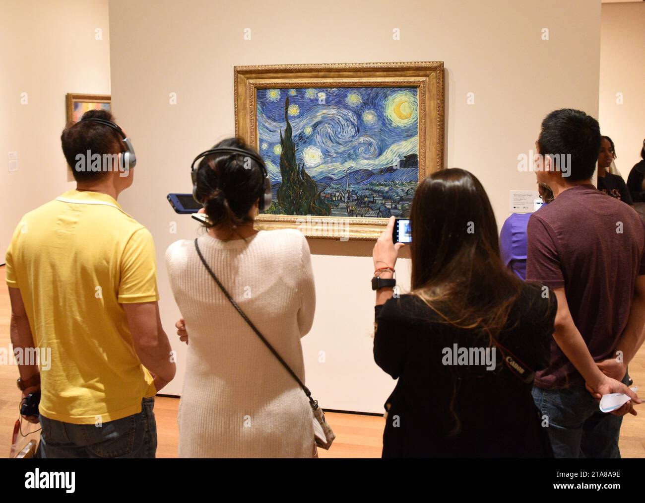 New York, USA - June 8, 2018: People near the Starry Night by Vincent van Gogh painting in Museum of Modern Art in New York City. Stock Photo