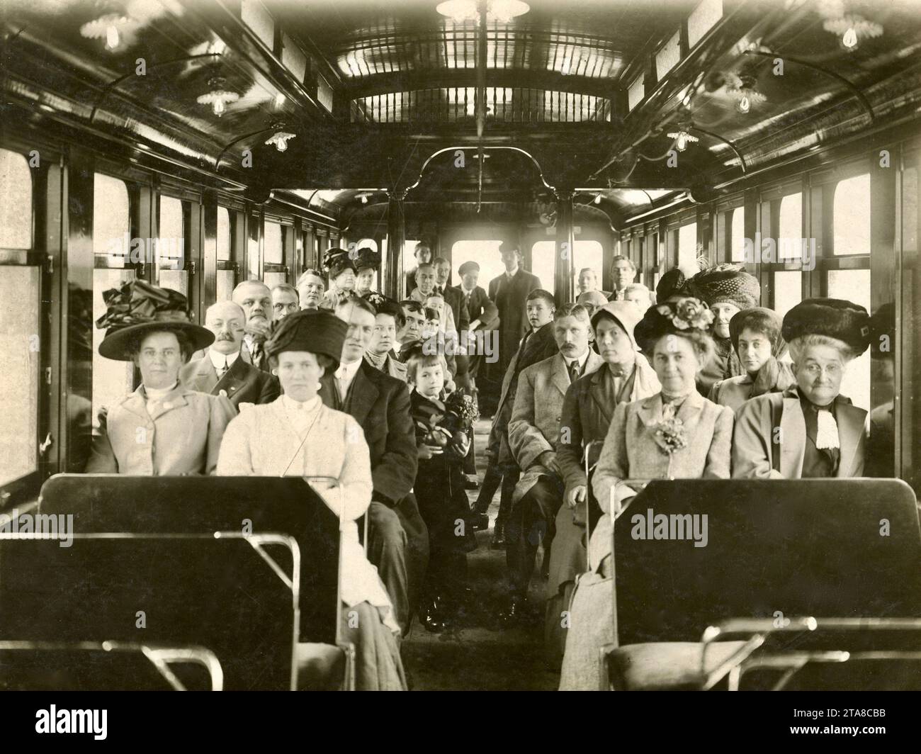 People 1900, Transportation 1900, Commuters, Trolley or Train Car Interior Stock Photo