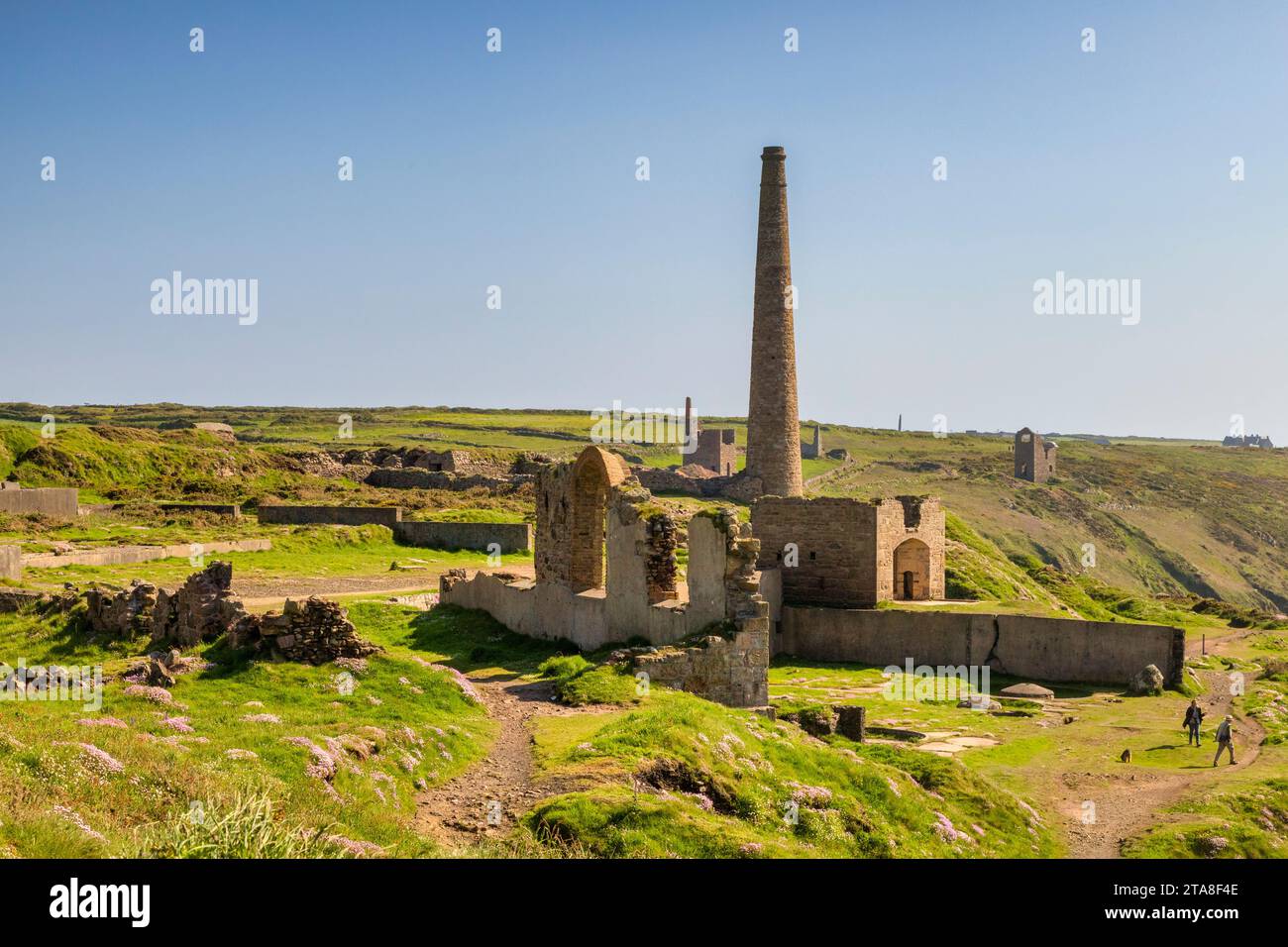 20 May 2023: Botallack, Cornwall, UK - A view over the Botallack Tin Mine, which stretches across the landscape, with several chimneys in view. Stock Photo