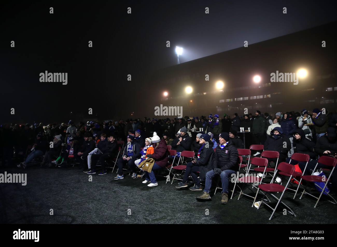 Ipswich Town fans in the fanzone watch the UEFA Champions League