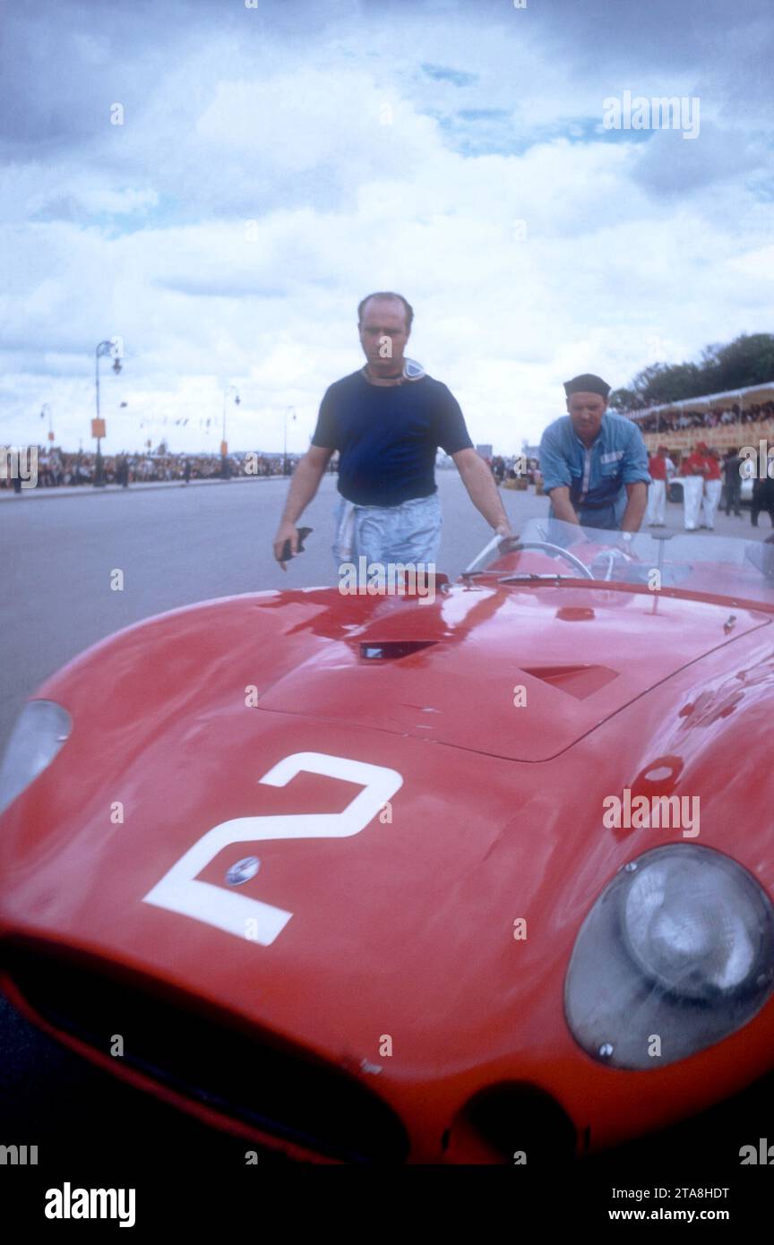HAVANA, CUBA - FEBRUARY 24:  Juan Manuel Fangio (1911-1995) driver of the Maserati 300S walks next to his car after the 1957 Cuban Grand Prix on February 24, 1957 in Havana, Cuba.  Fangio won the race.  (Photo by Hy Peskin) *** Local Caption *** Juan Manuel Fangio Stock Photo