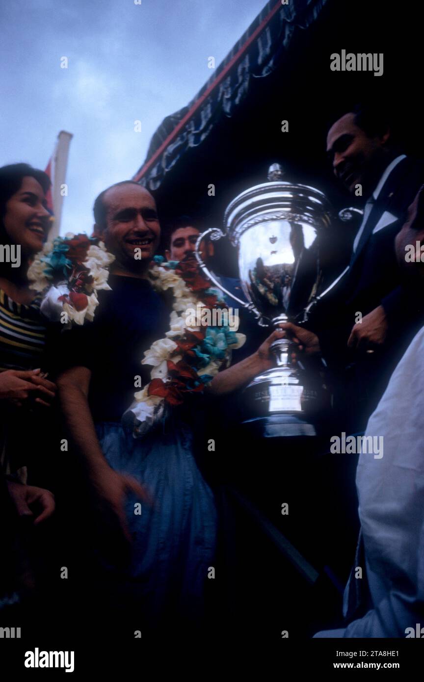 HAVANA, CUBA - FEBRUARY 24:  Juan Manuel Fangio (1911-1995) driver of the Maserati 300S receives the trophy from Cuban dictator Fulgencio Batista (1901-1973) after winning the 1957 Cuban Grand Prix on February 24, 1957 in Havana, Cuba.  (Photo by Hy Peskin) *** Local Caption *** Juan Manuel Fangio;Fulgencio Batista Stock Photo