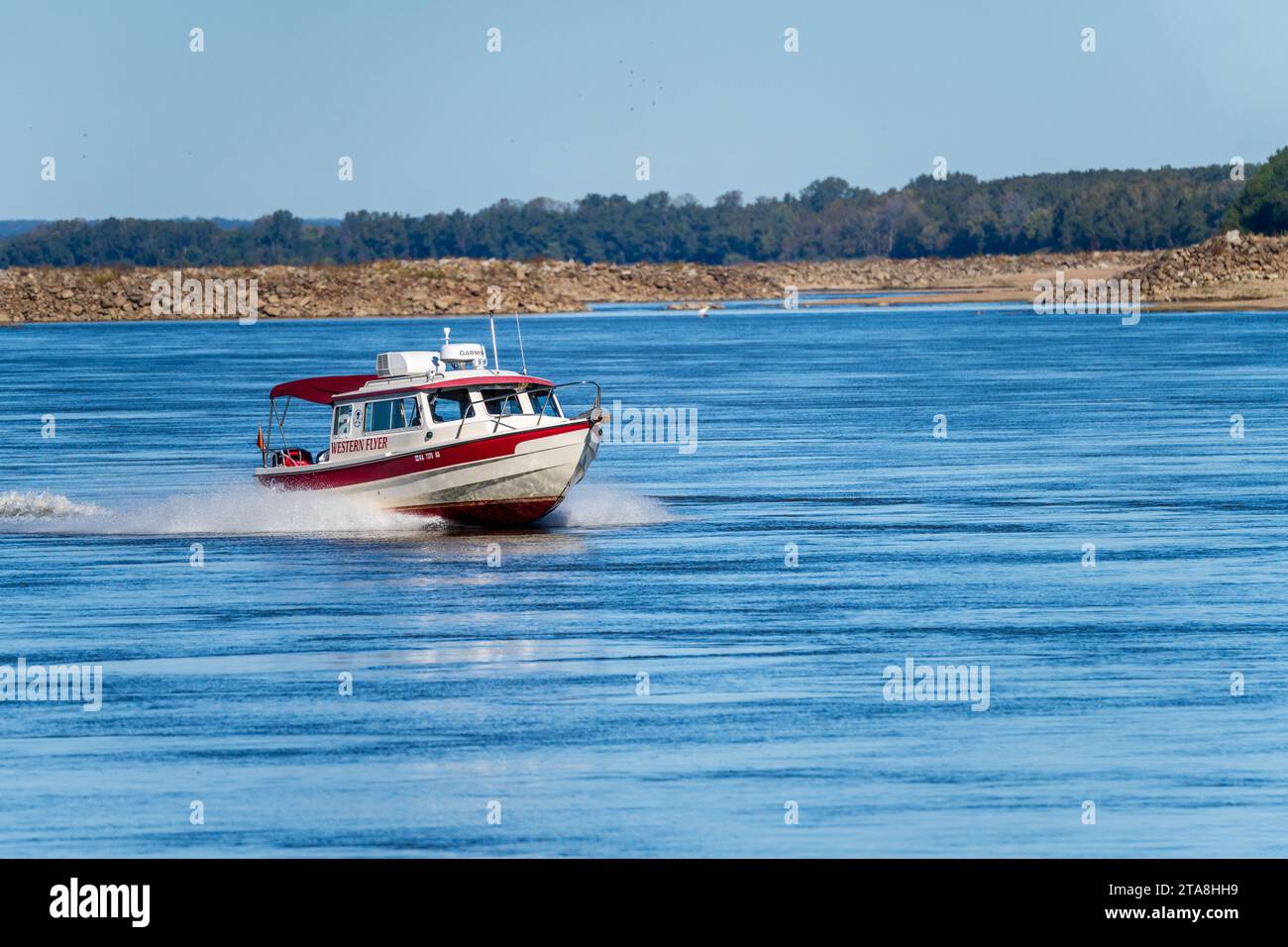 Cairo, IL 22 October 2023 Small speeding boat coming down the