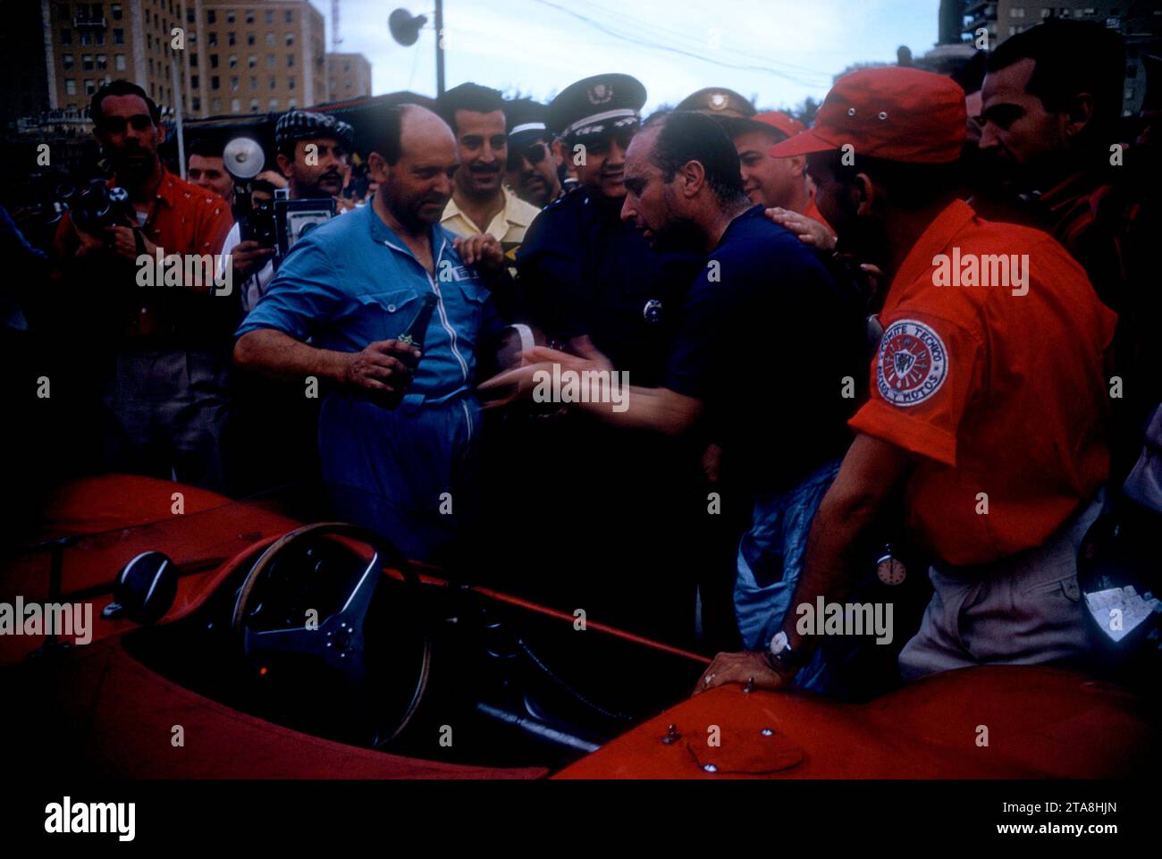 HAVANA, CUBA - FEBRUARY 24:  Juan Manuel Fangio (1911-1995) driver of the Maserati 300S stands next to his car after the 1957 Cuban Grand Prix on February 24, 1957 in Havana, Cuba.  Fangio won the race.  (Photo by Hy Peskin) *** Local Caption *** Juan Manuel Fangio Stock Photo