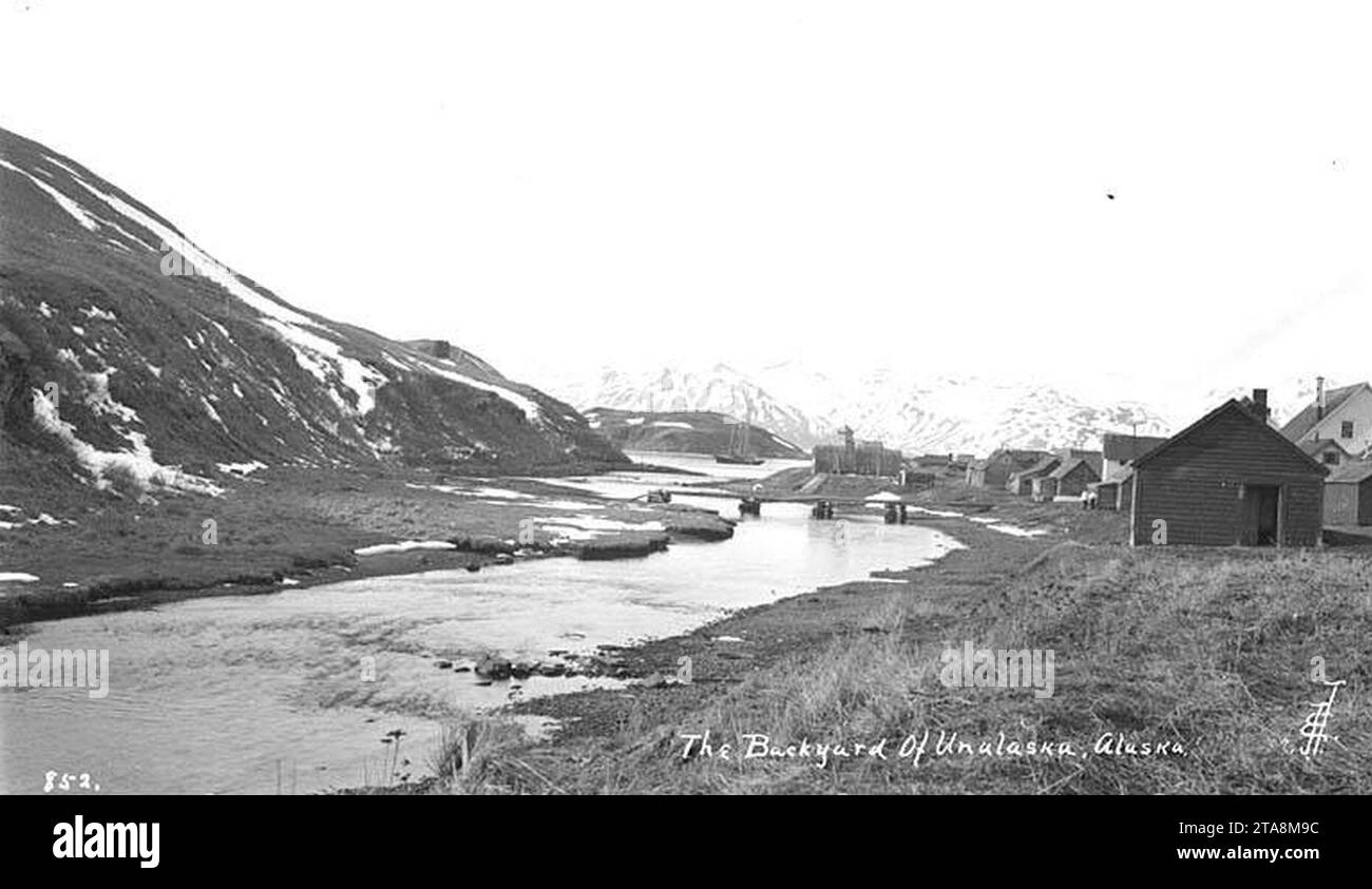 View looking up the Iliuliuk River towards Unalaska and mountains, ca 1912 Stock Photo Alamy