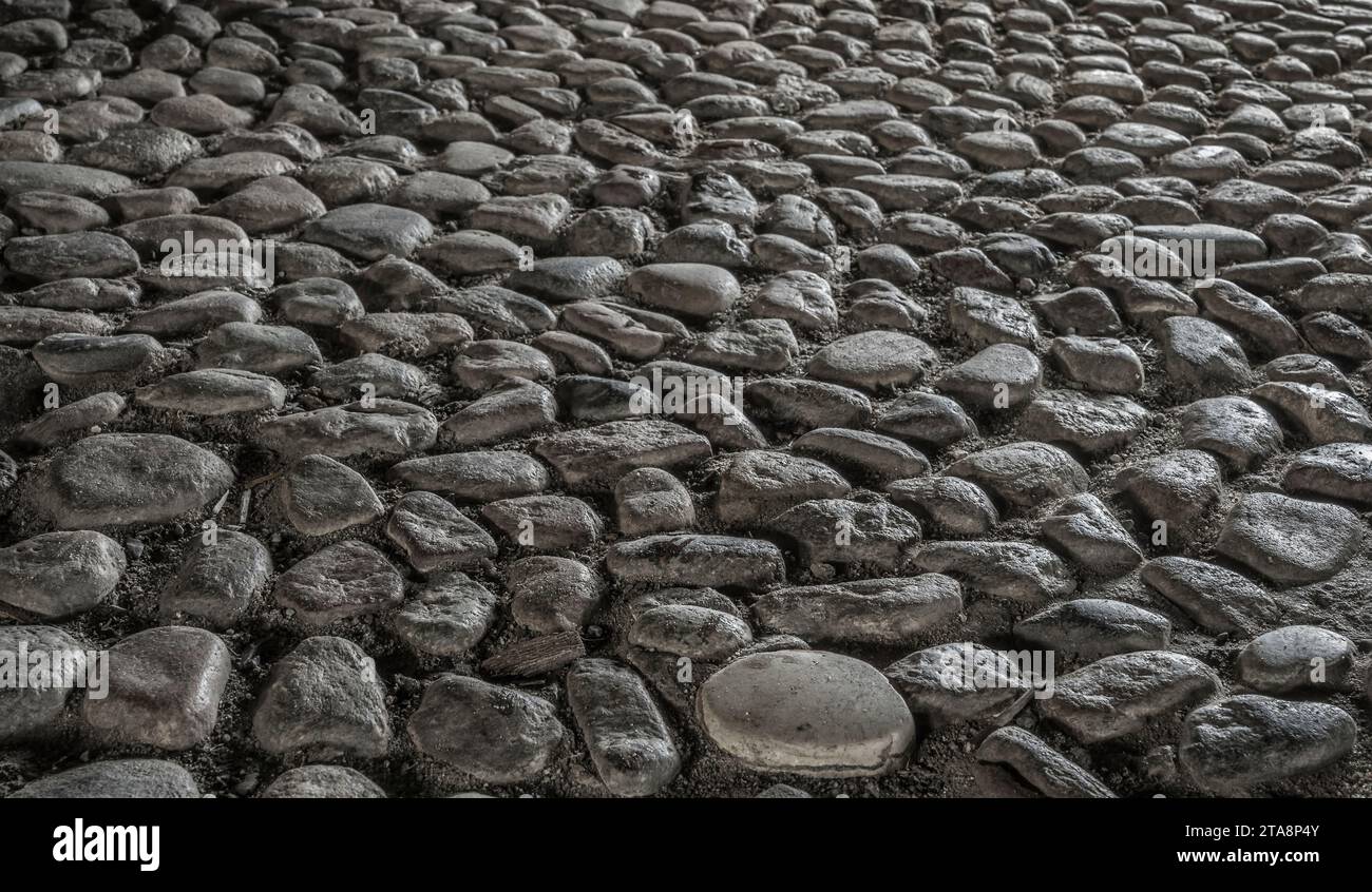 historic floor made of natural pebbles Stock Photo