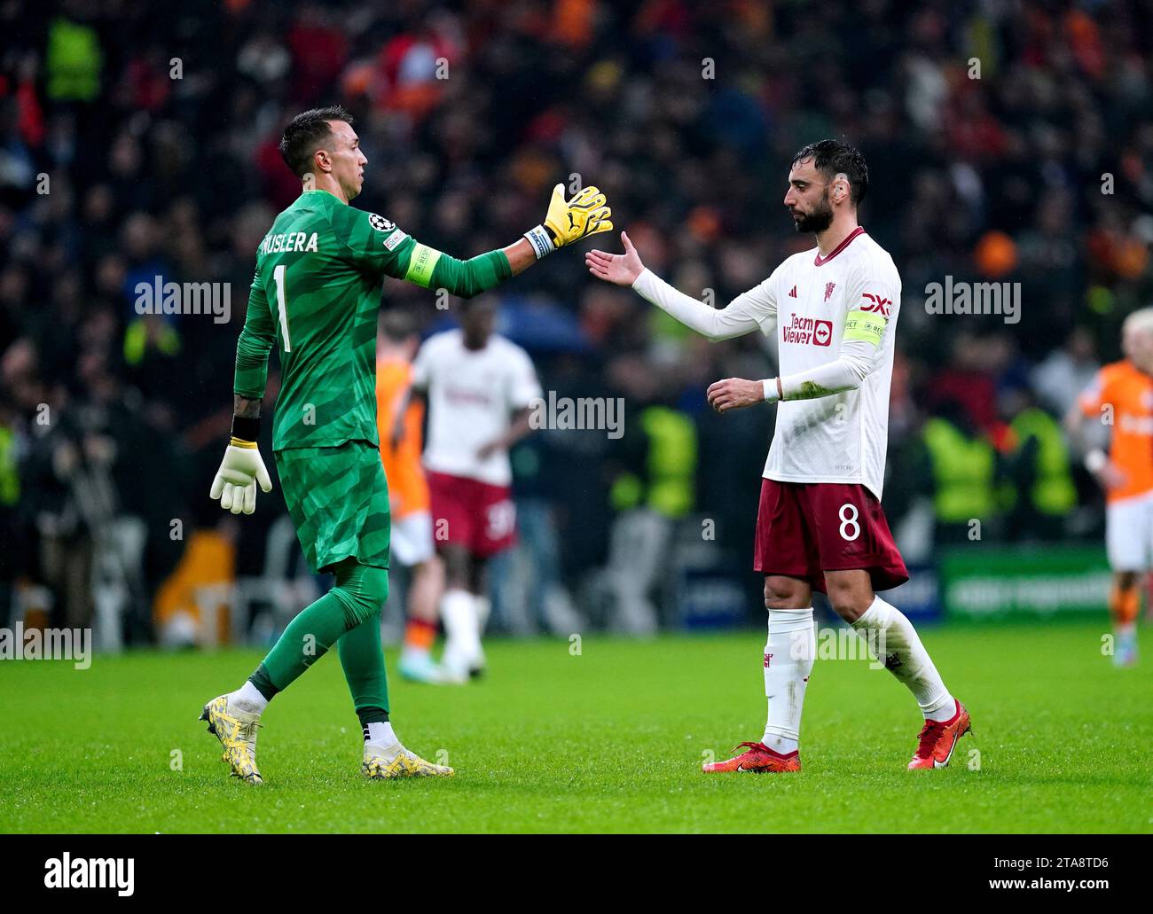 Manchester United's Bruno Fernandes shakes hands with Galatasaray goalkeeper Fernando Muslera at the end of the UEFA Champions League Group A match at RAMS Park, Istanbul. Picture date: Wednesday November 29, 2023. Stock Photo