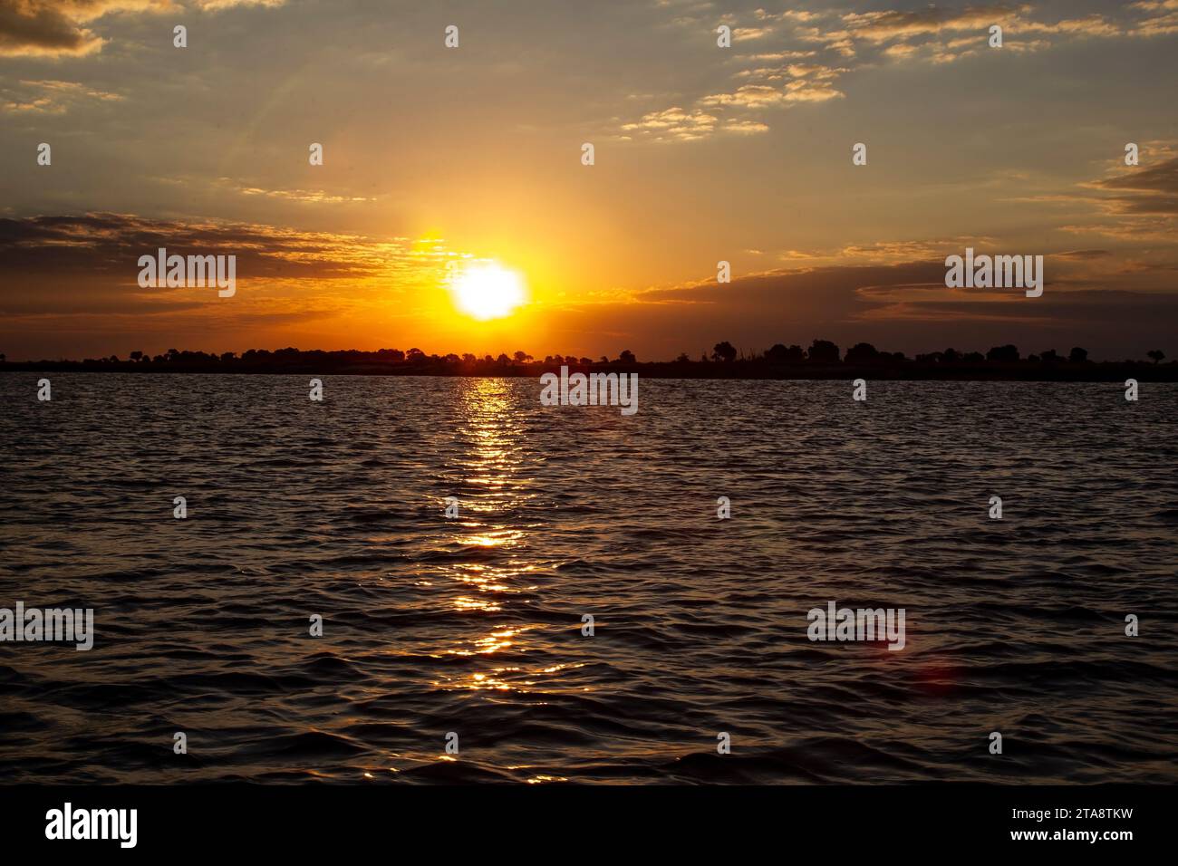 Sun setting over the Chobe river in Botswana Stock Photo