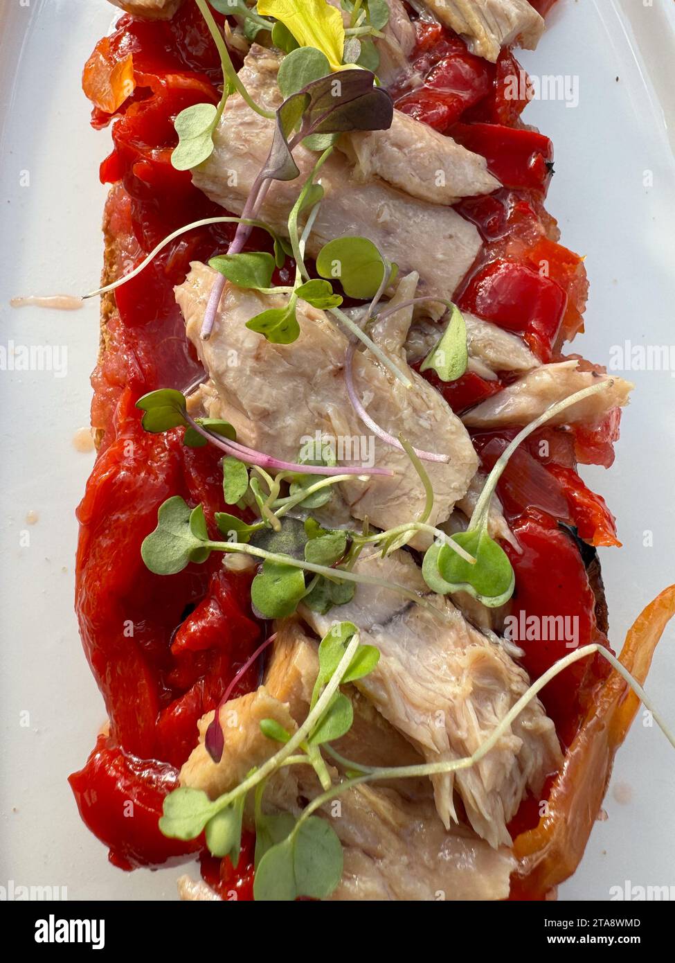 Tuna belly and red peppers toast Stock Photo